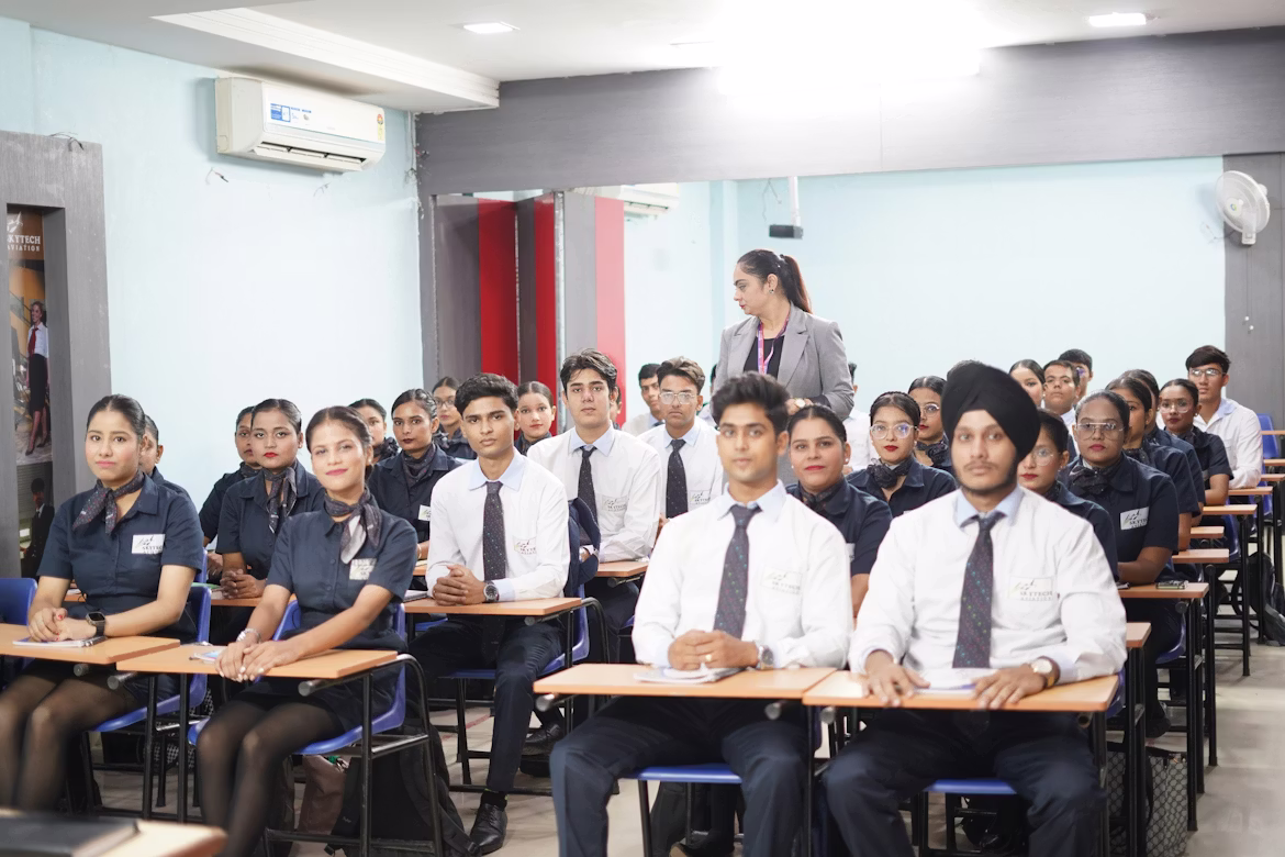 Students seated in an aviation training course classroom listening to an instructor during a professional training session.