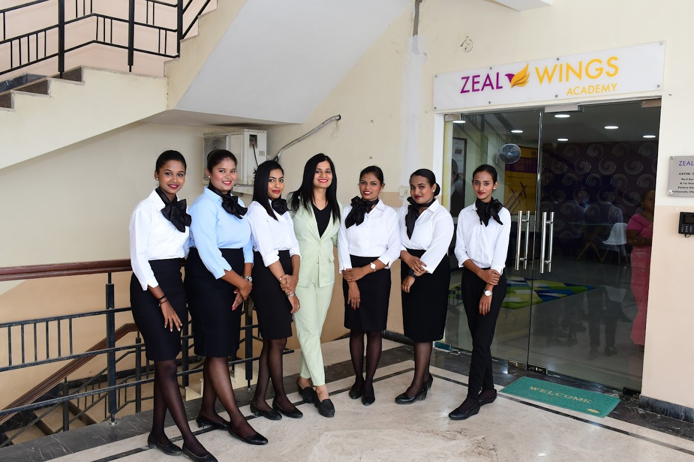 Aviation training student standing professionally in cabin crew uniform